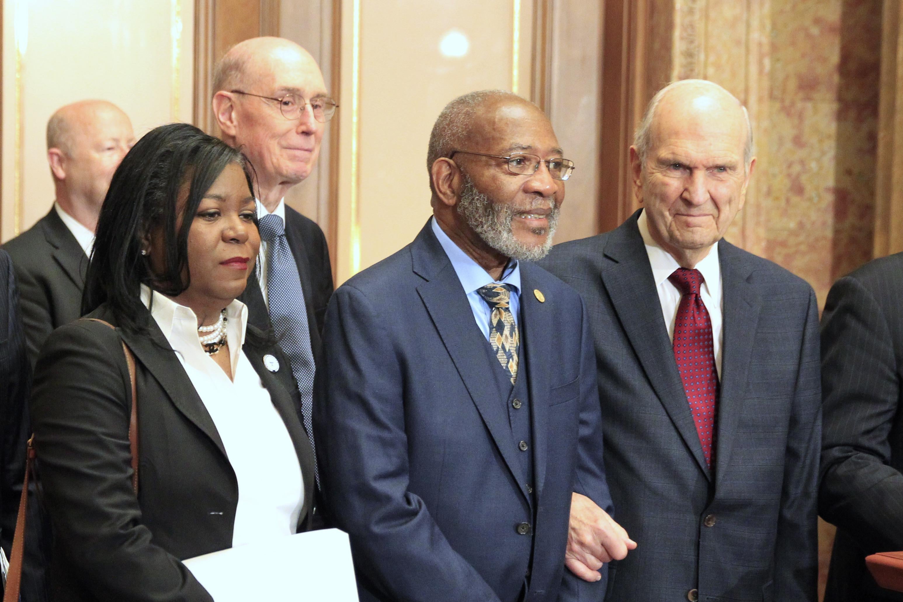 Reverend Theresa A. Dear, Henry B. Eyring Second Counselor in the First Presidency of the Mormon Church, Dr. Amos C. Brown Chairman of Interfaith relations for the NAACP and President of the Mormon Church Russell M. Nelson wait for a press conference to start at The Church of Jesus Christ of Latter Day Saints Administration Building on May 17, 2018 in Salt Lake City, Utah.