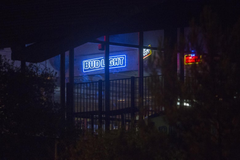 A neon Bud Light sign at Borderline Bar & Grill