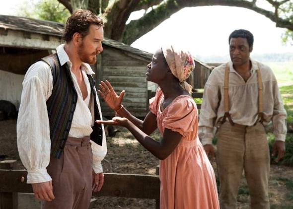 Chiwetel Ejiofor, Michael Fassbender and Lupita Nyong'o in 12 Years a Slave (2013).