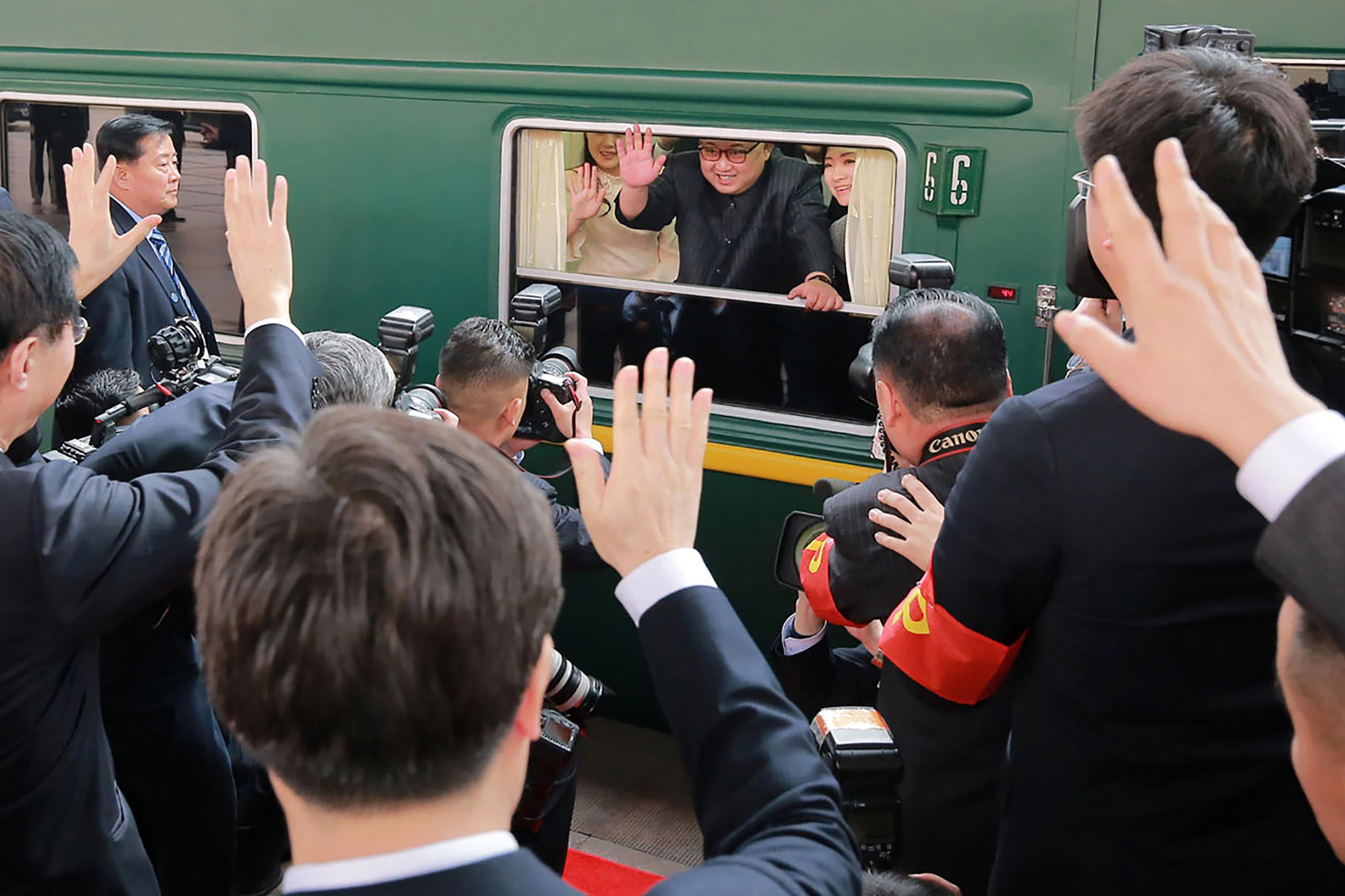 This picture from North Korea's official Korean Central News Agency (KCNA) taken on March 27, 2018 and released on March 28, 2018 shows North Korean leader Kim Jong Un (C) waving from his train as it prepares to depart from Beijing railway station.
North Korean leader Kim Jong Un was treated to a lavish welcome by Chinese President Xi Jinping during a secretive trip to Beijing as both sides seek to repair frayed ties ahead of landmark summits with Seoul and Washington.  / AFP PHOTO / KCNA VIA KNS / - / South Korea OUT / REPUBLIC OF KOREA OUT   ---EDITORS NOTE--- RESTRICTED TO EDITORIAL USE - MANDATORY CREDIT 'AFP PHOTO/KCNA VIA KNS' - NO MARKETING NO ADVERTISING CAMPAIGNS - DISTRIBUTED AS A SERVICE TO CLIENTS
THIS PICTURE WAS MADE AVAILABLE BY A THIRD PARTY. AFP CAN NOT INDEPENDENTLY VERIFY THE AUTHENTICITY, LOCATION, DATE AND CONTENT OF THIS IMAGE. THIS PHOTO IS DISTRIBUTED EXACTLY AS RECEIVED BY AFP.  /         (Photo credit should read -/AFP/Getty Images)