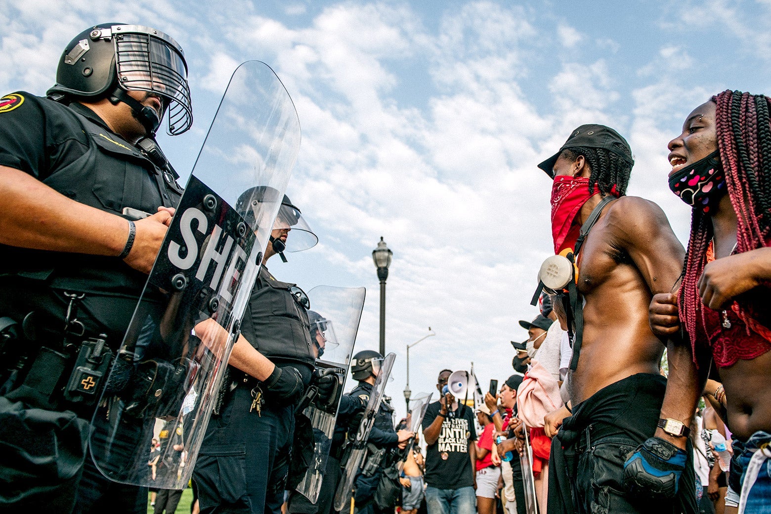 Police in riot gear face off against Black Lives Matter protesters
