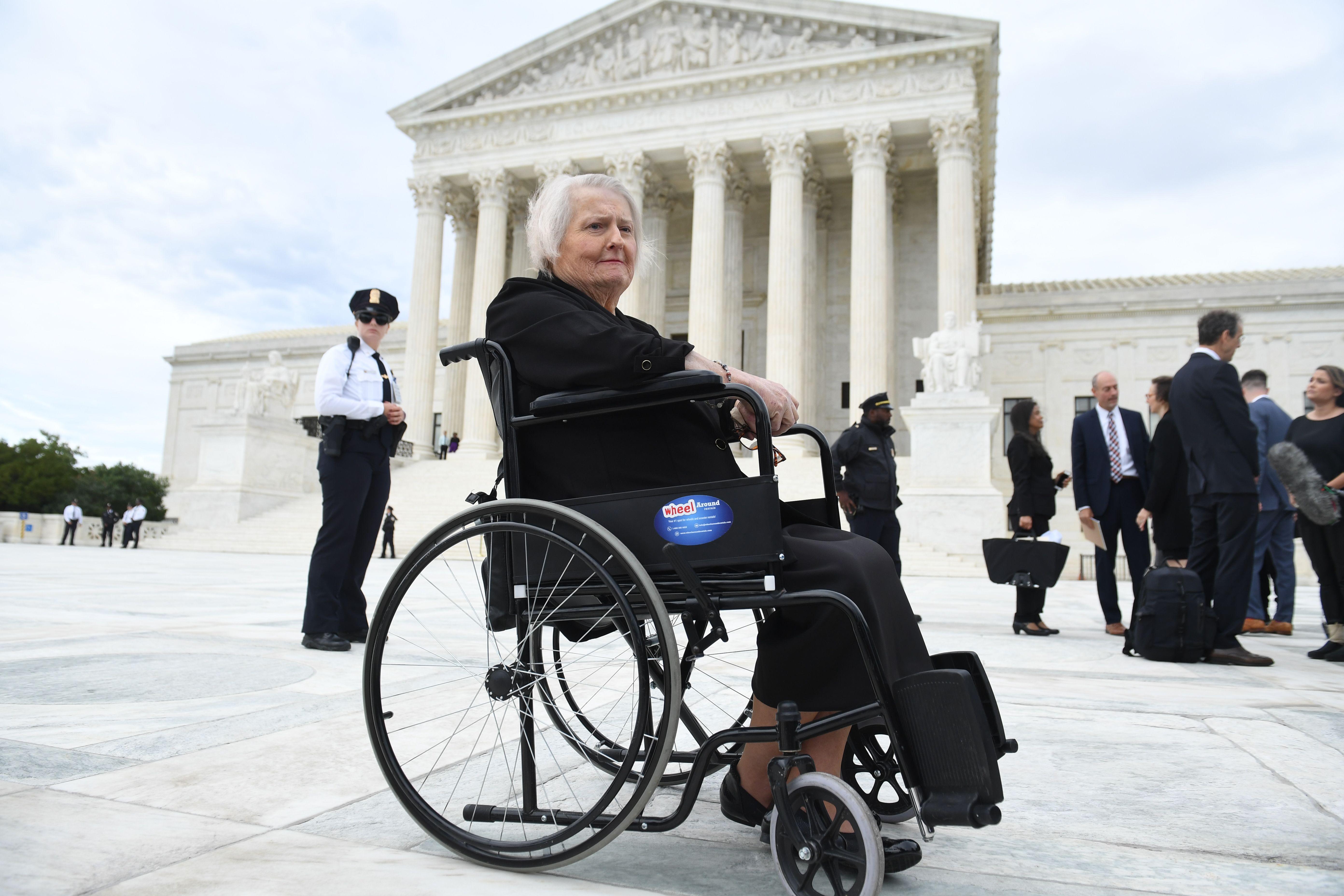 Aimee Stephens in front of the Supreme Court in her wheelchair.