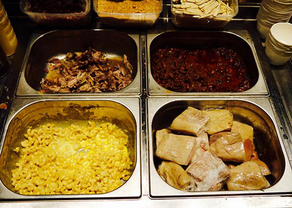 The pulled pork, baked beans, mac and cheese, and biscuit station at Truck De Luxe.