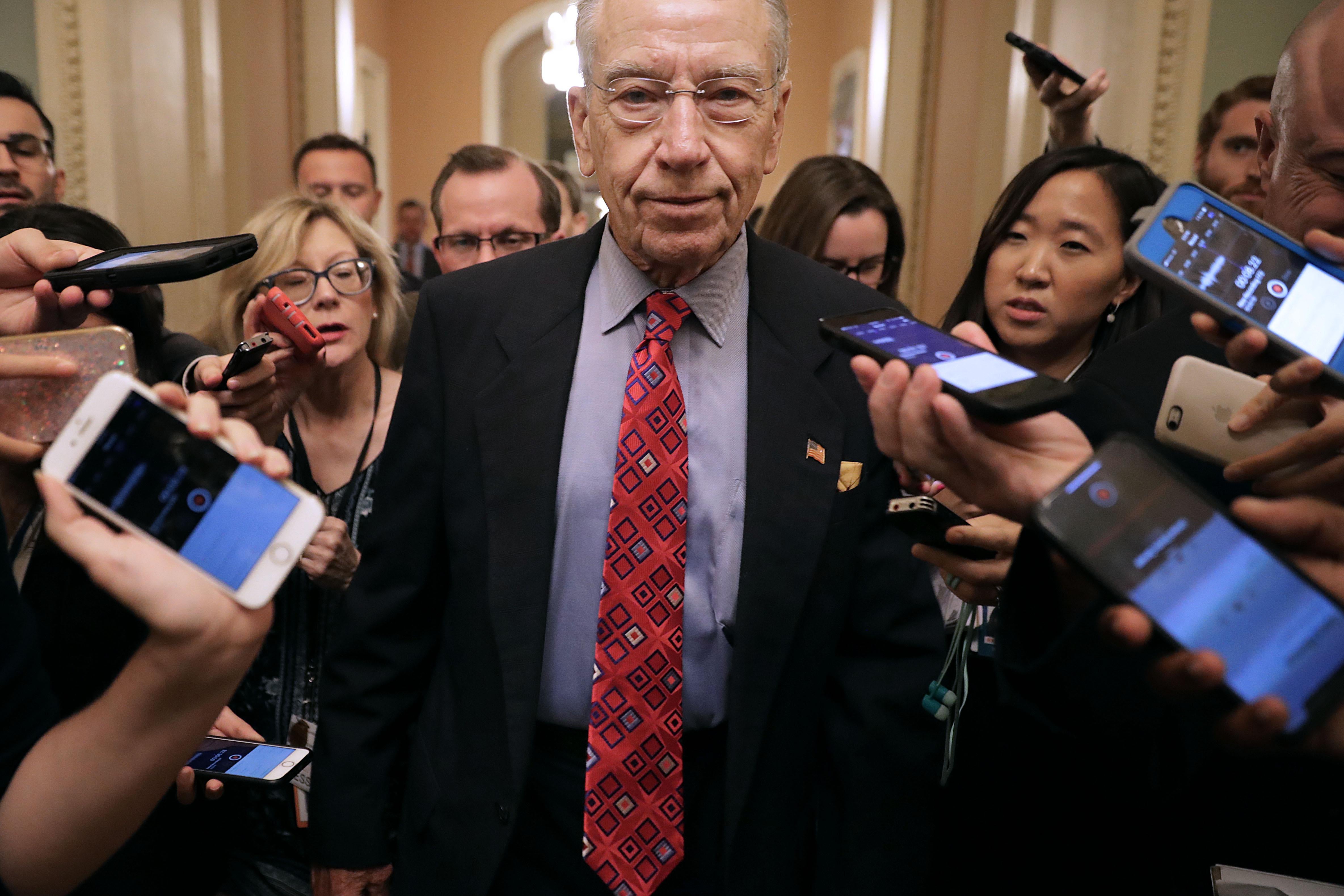 Senate Judiciary Committee Chairman Charles Grassley talks with reporters as he leaves a meeting in the Capitol.