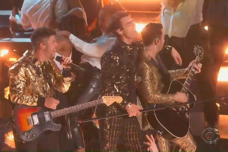 Nick, Joe, and Kevin Jonas perform onstage at the Grammys.