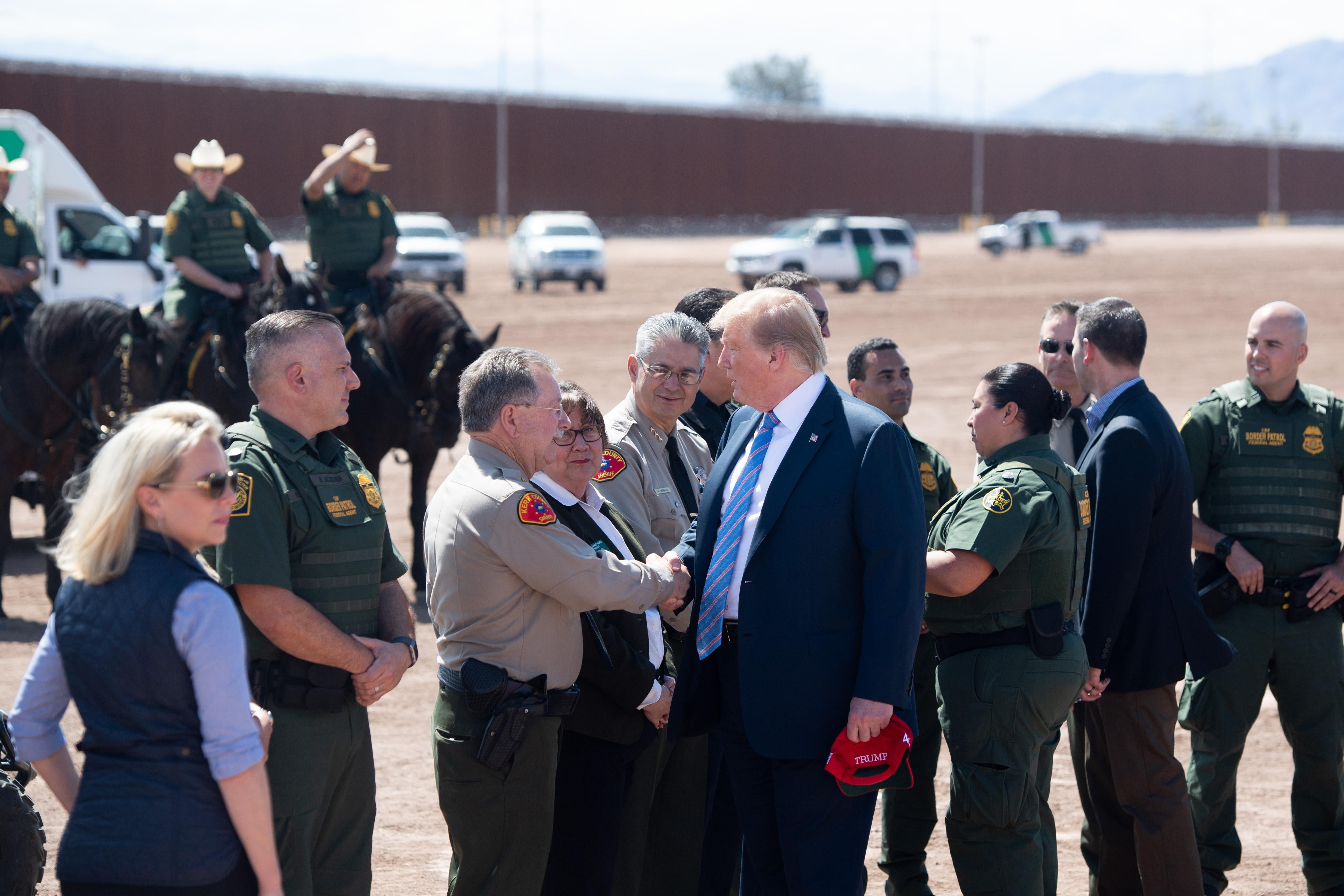 President Donald Trump tours the border wall between the United States and Mexico in Calexico, California on April 5, 2019.