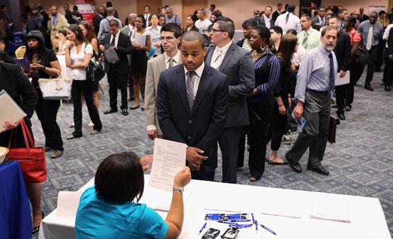 Job applicants line up to meet potential employers at a job fair on June 11, 2012 in New York City.