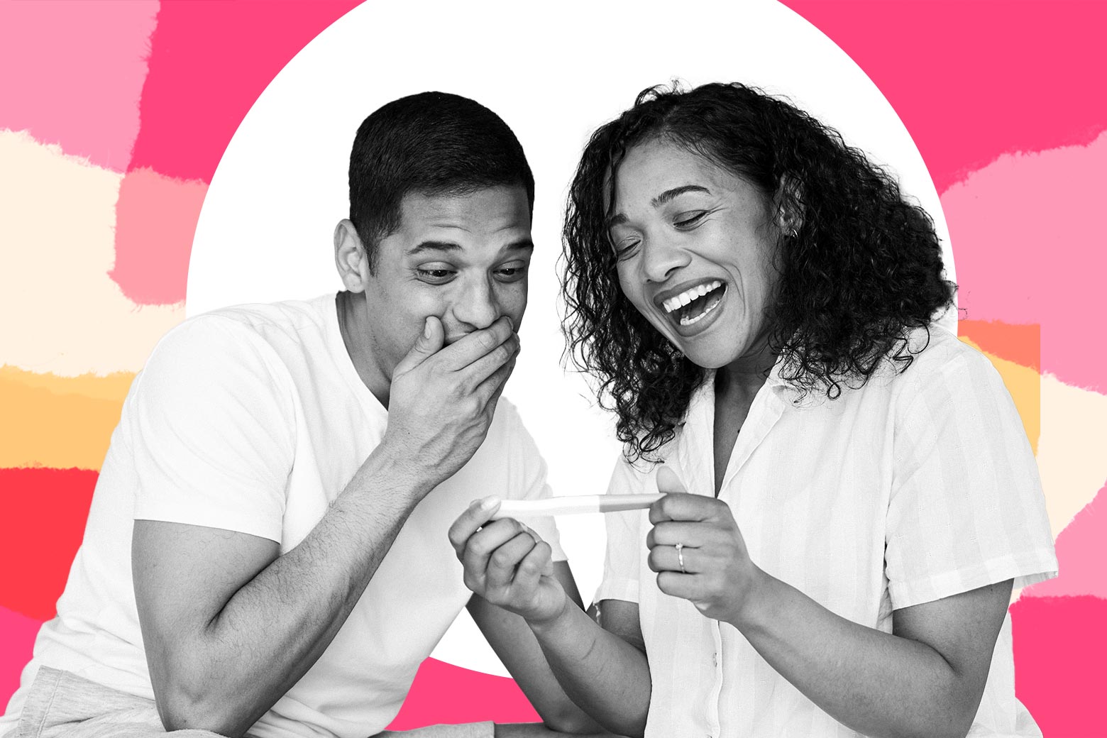 A couple looks happy at a pregnancy test.