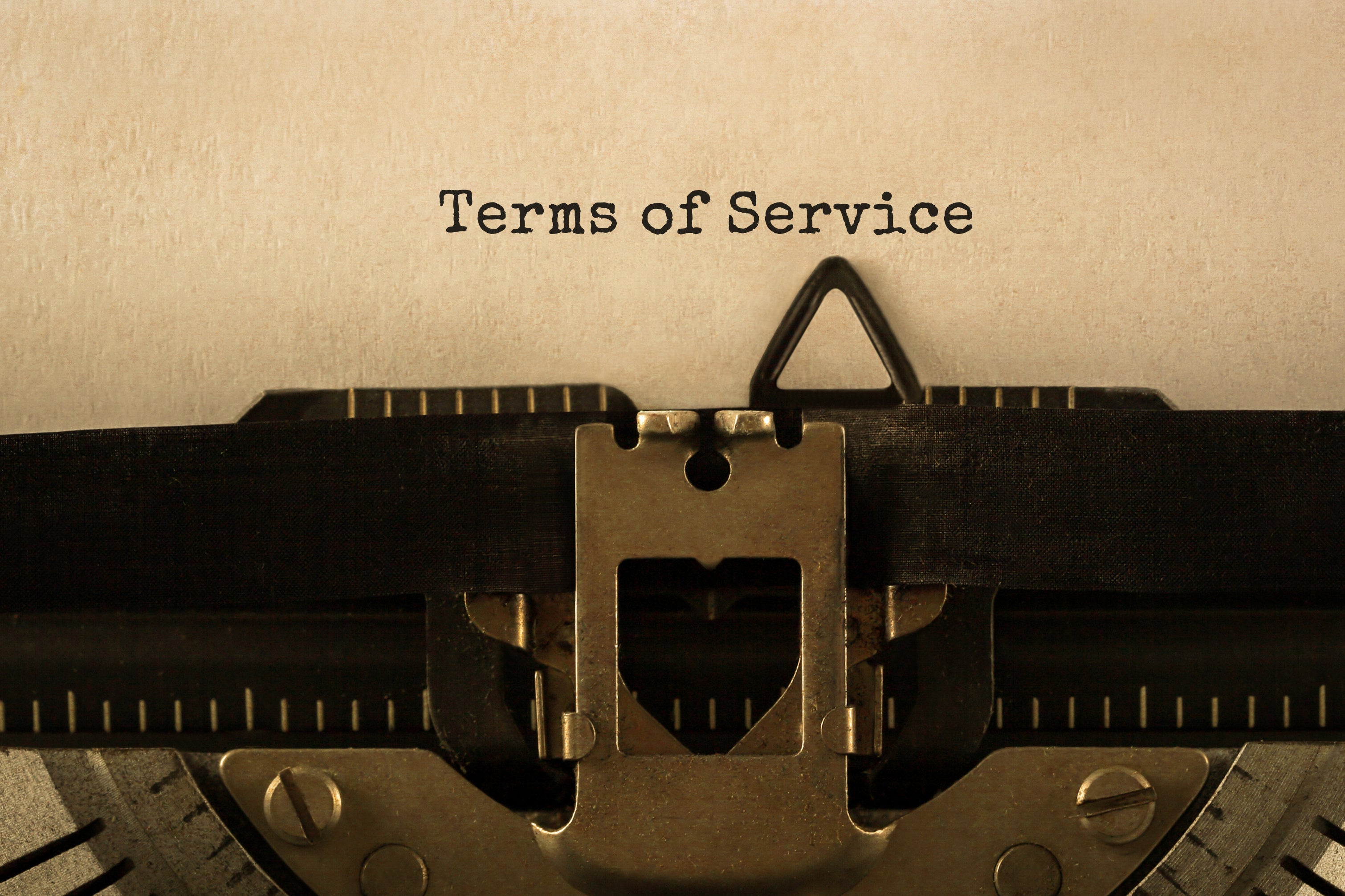 "Terms of service" appears on a typewriter.