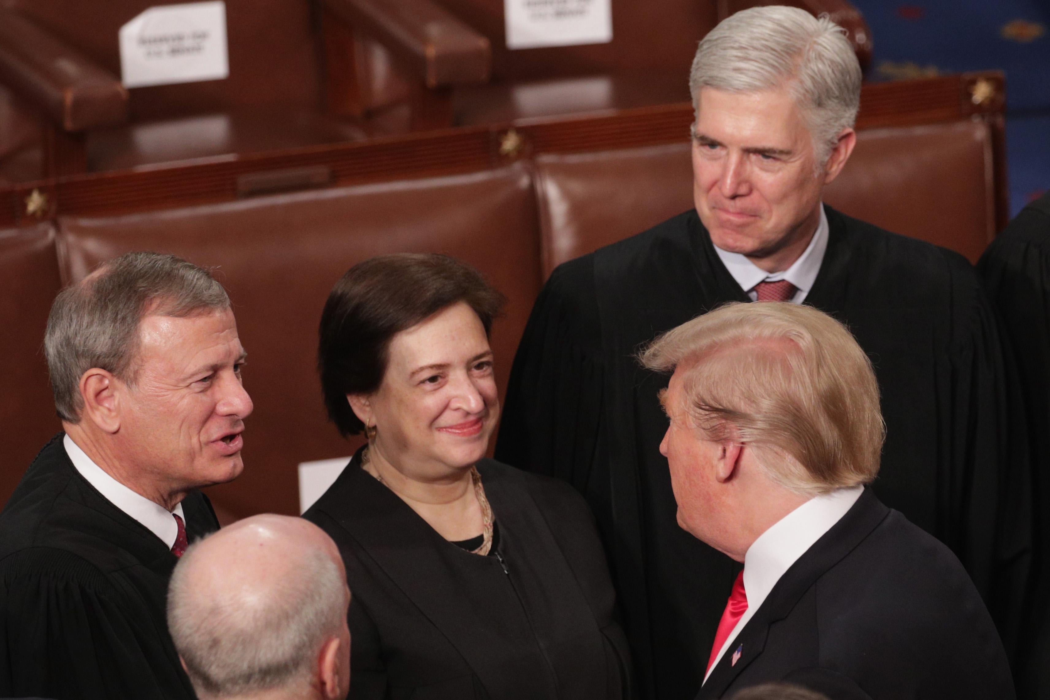 Supreme Court Justices John Roberts, Elena Kagan, and Neil Gorsuch greet President Donald Trump after the State of the Union address on Feb. 5 in Washington.