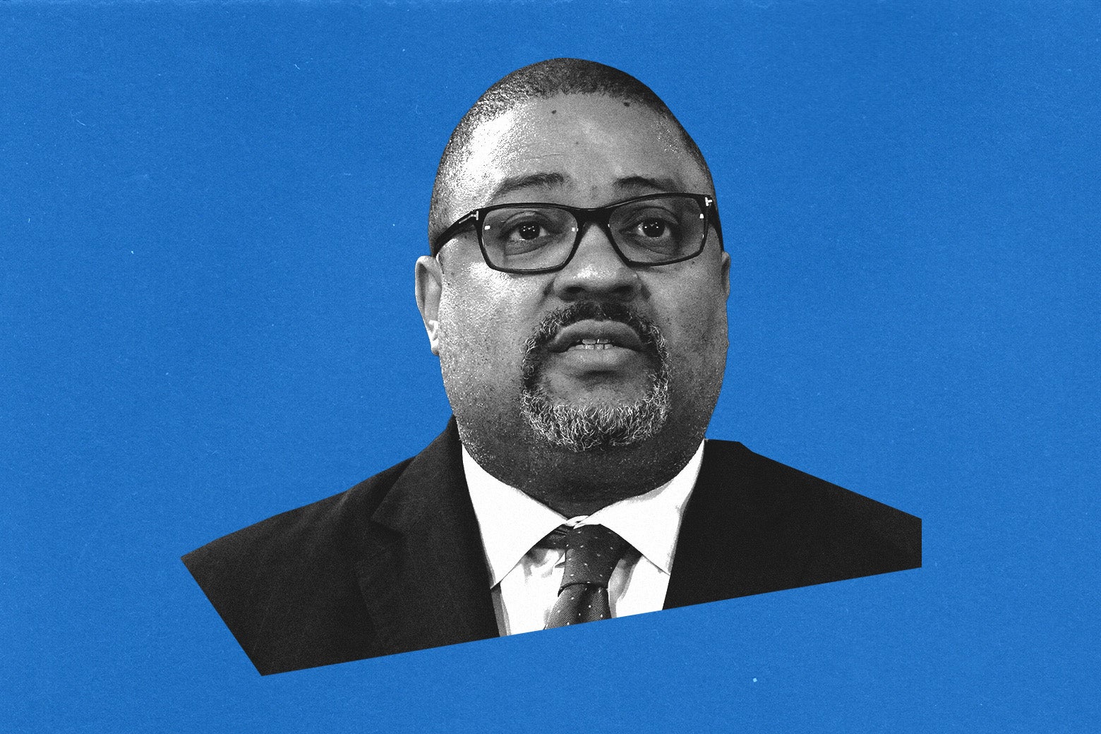 Bragg in glasses and wearing a goatee against a blue backdrop.
