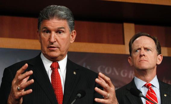 Sen. Joe Manchin, D-W.Va., and Sen. Pat Toomey, R-Pa., hold a news conference on background checks for firearms on Capitol Hill in Washington April 10, 2013.