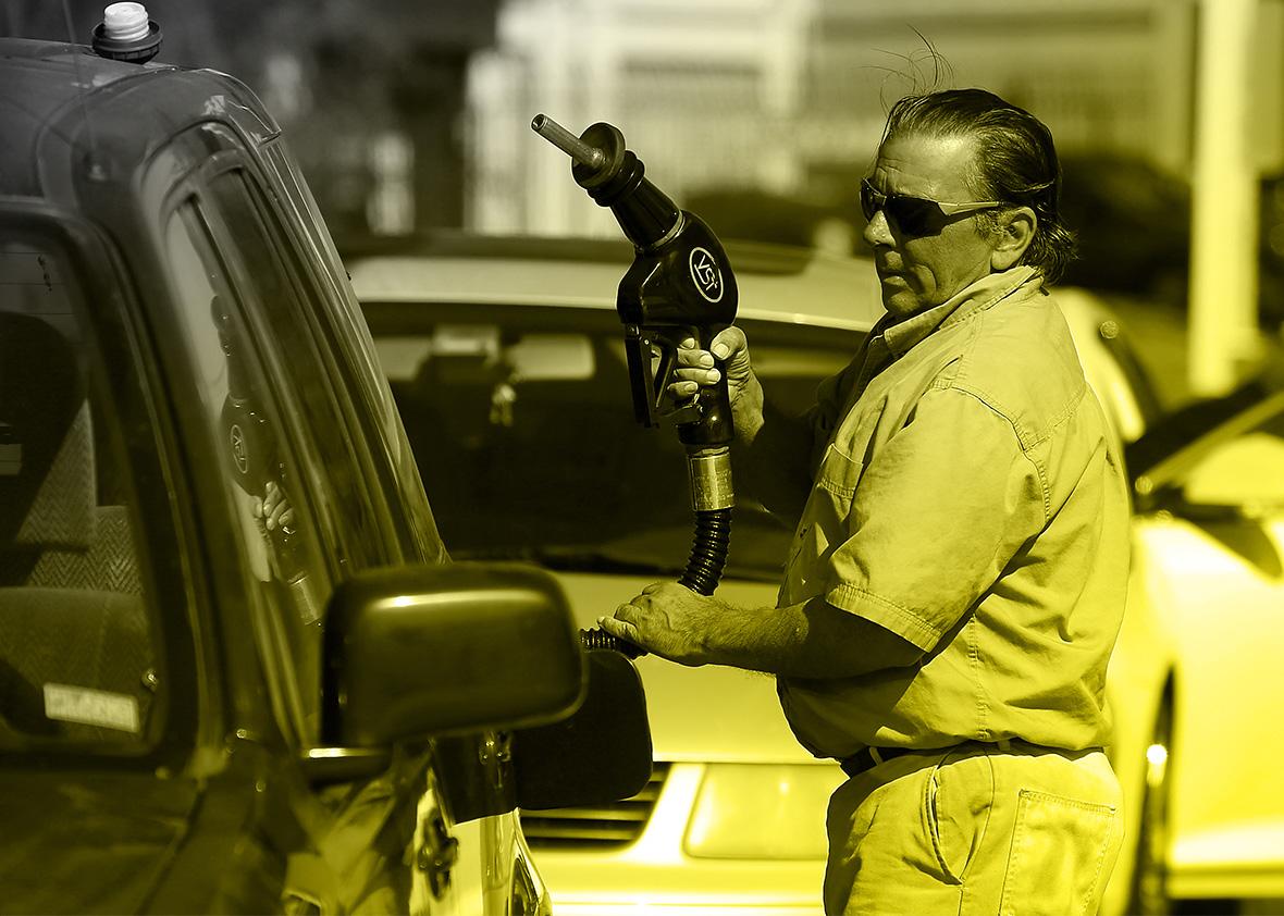 A customer prepares to pump gasoline.
