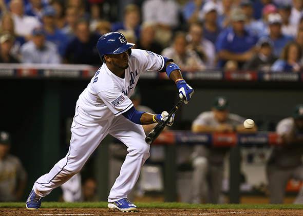 Alcides Escobar #2 of the Kansas City Royals hits a sacrifice bunt in the third inning against Oakland Athletics during the American League Wild Card game.