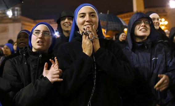Nuns from the 'Instituto Serve del Signore, E Della Vergine Di Matara,' (Servants of the Lord and the Virgin of Matara,) react to the black smoke.