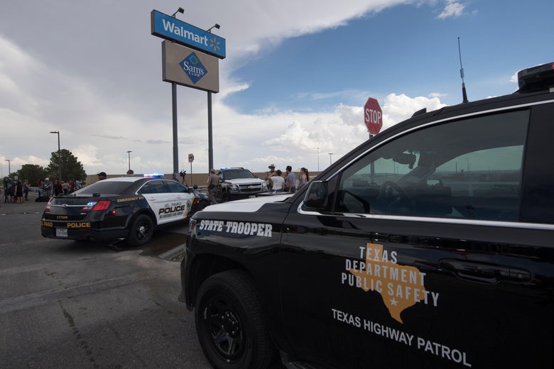 El Paso Police and Texas Highway Patrol cars, with the Walmart sign in the background.