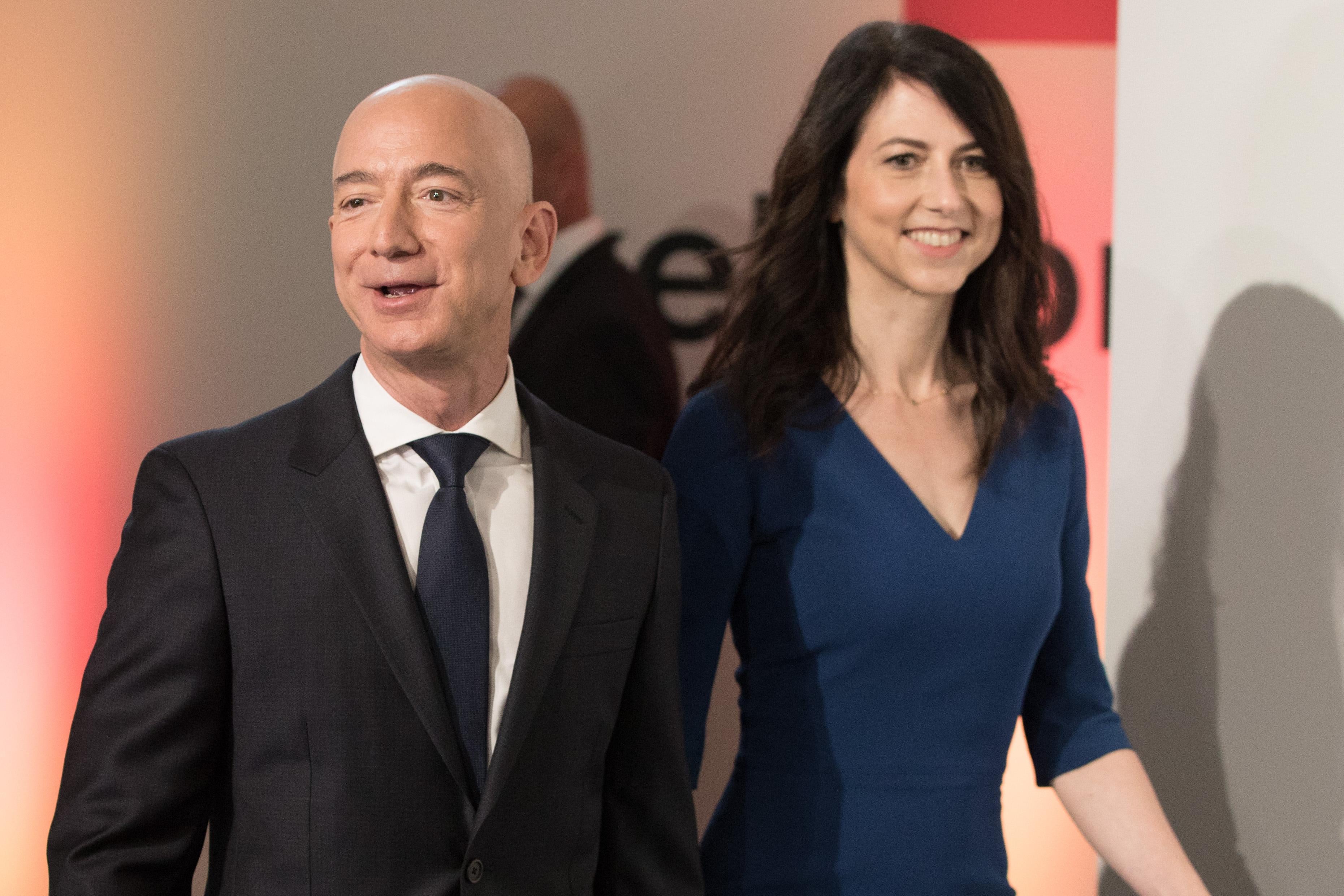 Amazon CEO Jeff Bezos and his wife MacKenzie Bezos arrive at an event.