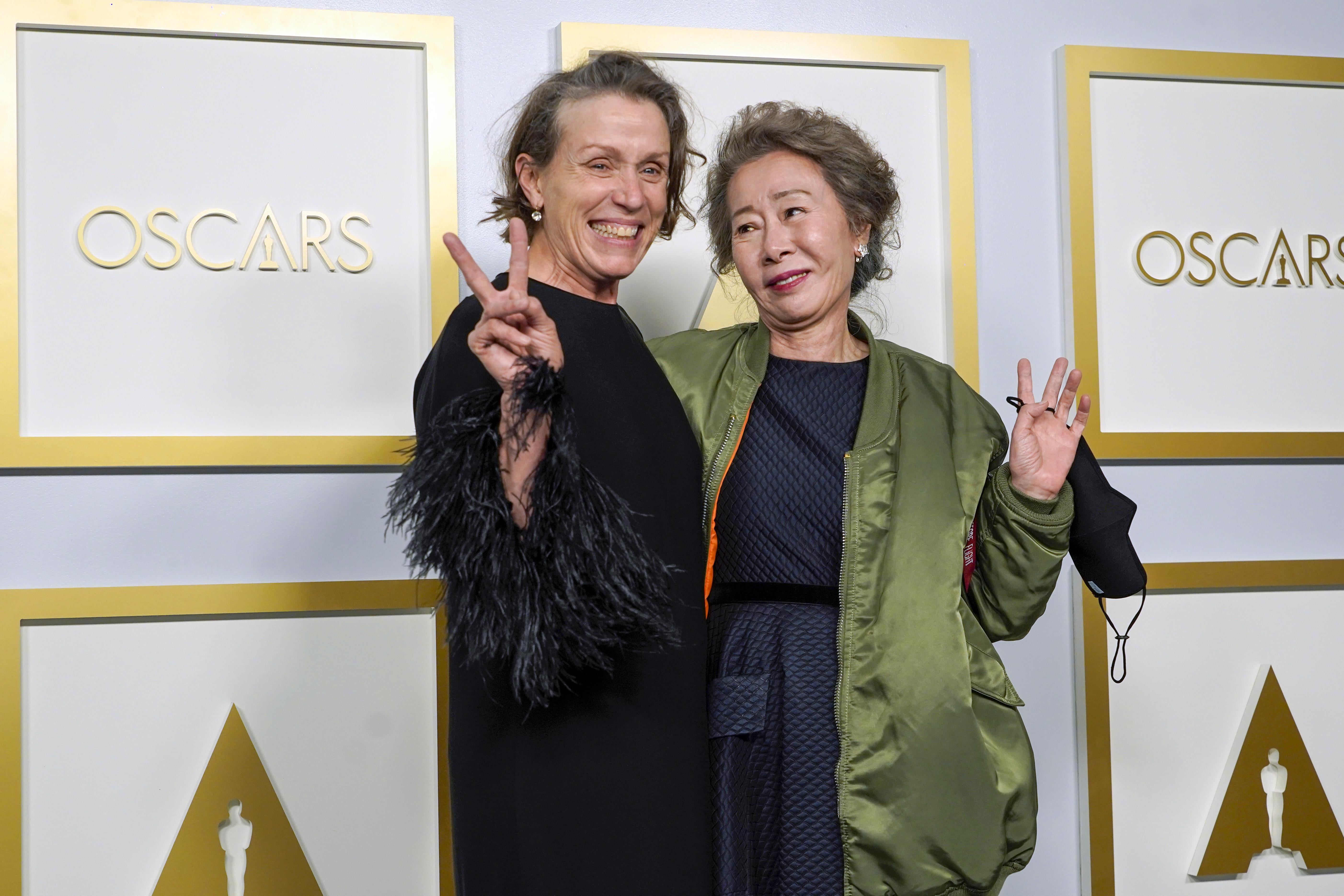 LOS ANGELES, CALIFORNIA - APRIL 25: (L-R) Frances McDormand, winner of Best Actress in a Leading Role for "Nomadland," and Yuh-Jung Youn, winner of Best Actress in a Supporting Role for "Minari," pose in the press room at the Oscars on Sunday, April 25, 2021, at Union Station in Los Angeles. (Photo by Chris Pizzello-Pool/Getty Images)