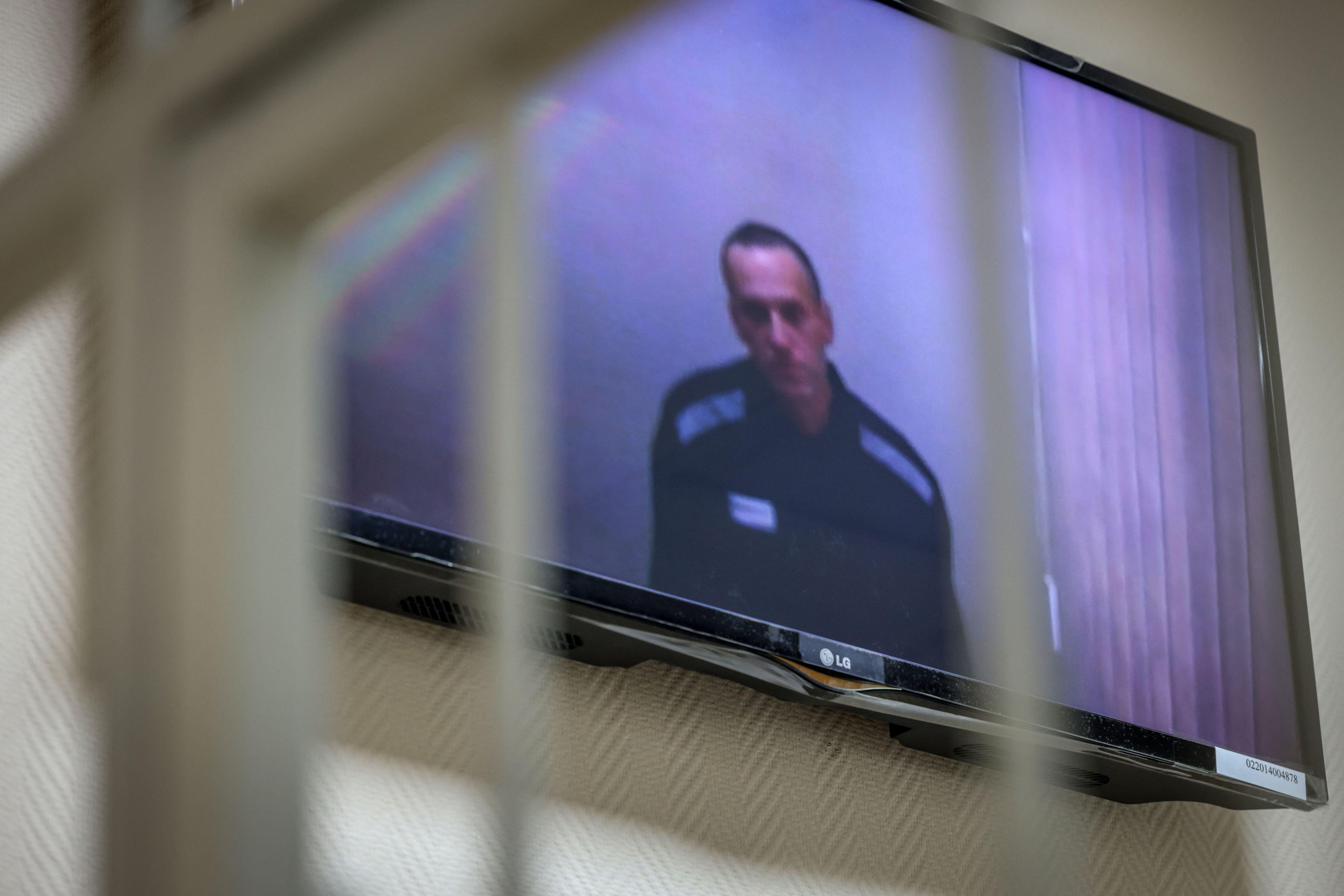Russian opposition politician Alexei Navalny appears on screen via a video link from prison during a court hearing on May 26, 2021.