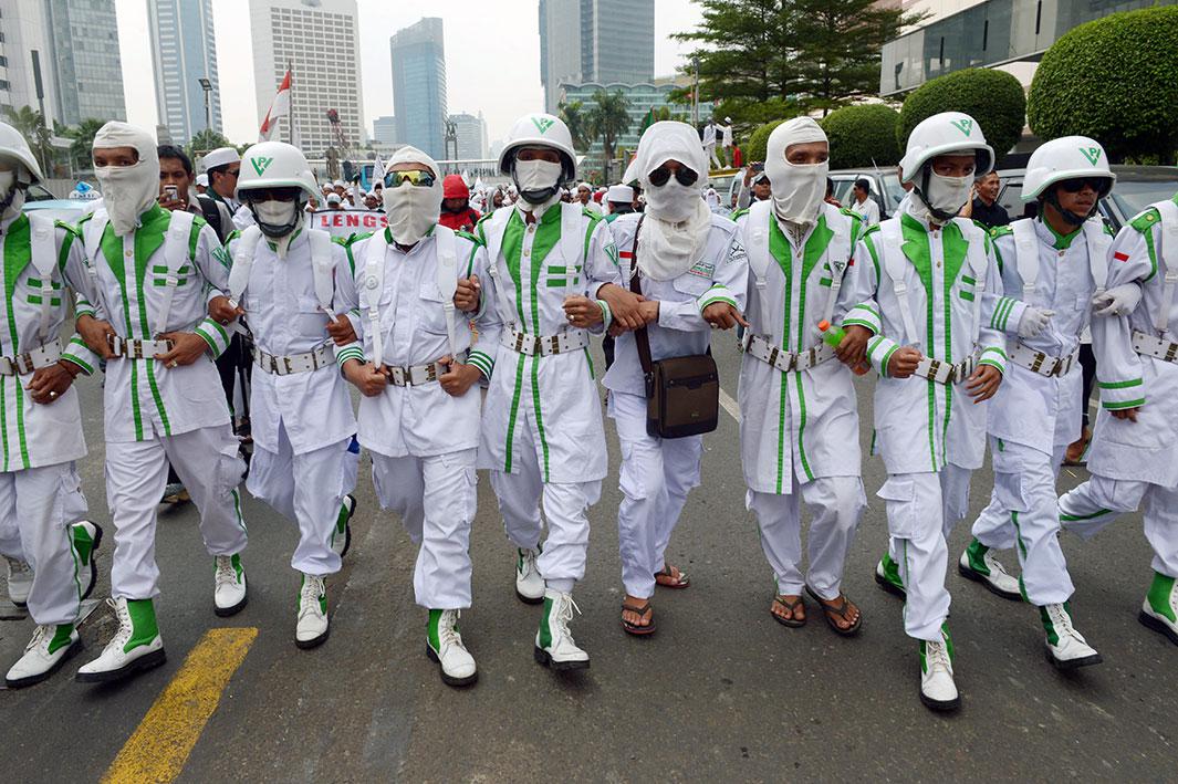 Muslim groups led by the Islamic Defenders Front march toward the Jakarta, Indonesia, parliament building during a protest against acting Jakarta governor Basuki Tjahaja Purnama on Nov. 10, 2014. Muslim groups led by the Islamic Defenders Front have demanded the governor be prevented from taking office because of his ethnicity and religion