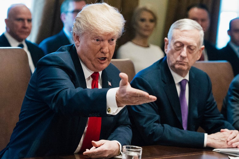 Donald Trump with Jim Mattis seated beside him.