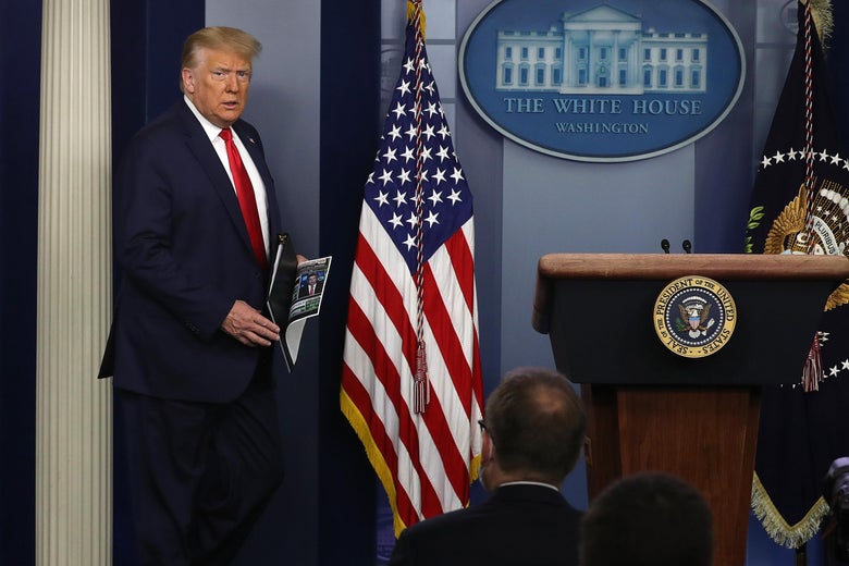 Trump walks by an American flag on his way to the podium.