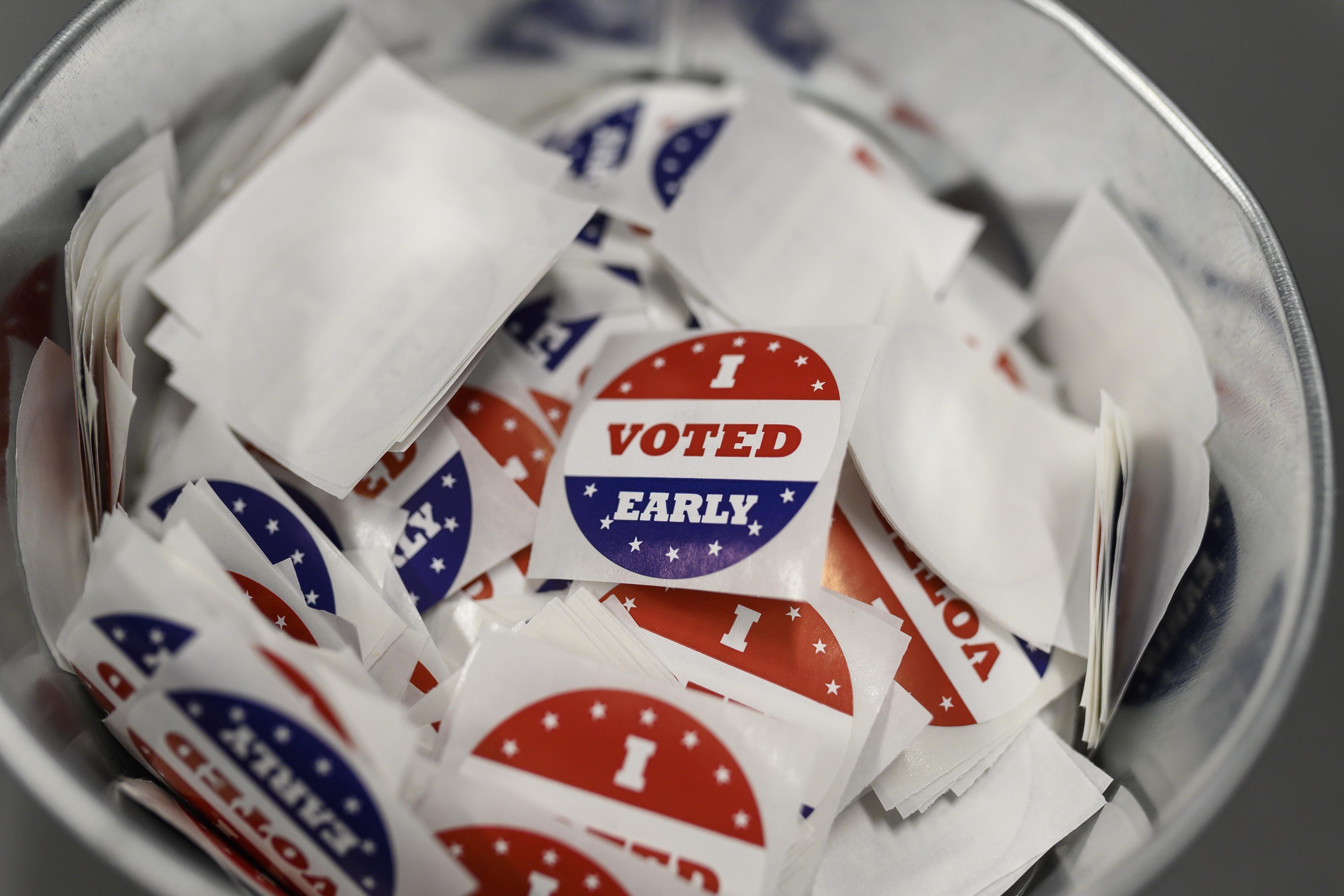 A bucket of "I Voted Early" stickers. 