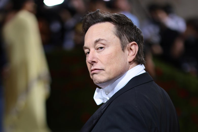 Musk mugging in a tux on the red carpet