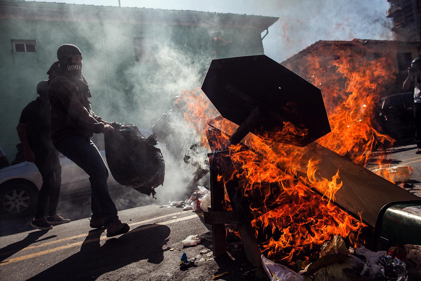 Demonstrators from the anarchist group Black Bloc clash with police during a protest against the World Cup on the opening day of the event on June 12, 2014 in Sao Paulo, Brazil.