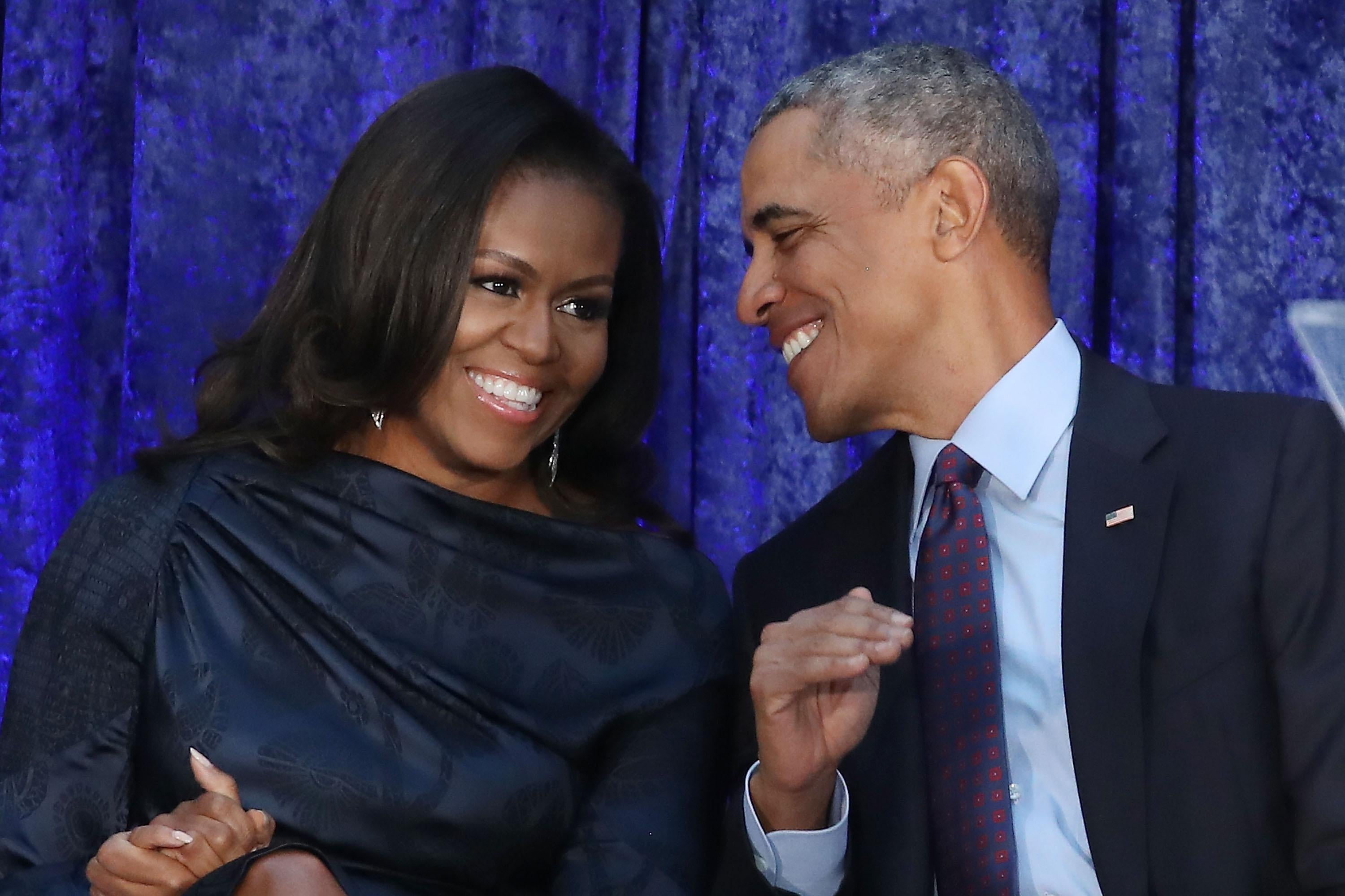 WASHINGTON, DC - FEBRUARY 12:  Former U.S. President Barack Obama and first lady Michelle Obama participate in the unveiling of their official portraits during a ceremony at the Smithsonian's National Portrait Gallery, on February 12, 2018 in Washington, DC. The portraits were commissioned by the Gallery, for Kehinde Wiley to create President Obama's portrait, and Amy Sherald that of Michelle Obama.  (Photo by Mark Wilson/Getty Images)