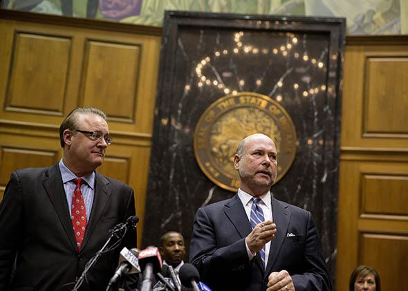 Indiana House Speaker Brian Bosma speaks as Senate President Pro Tem David Long (left) looks on during a press conference about anti-discrimination safeguards added to the controversial Religious Freedom Restoration Act on April, 2, 2015 at the State Capitol in Indianapolis.