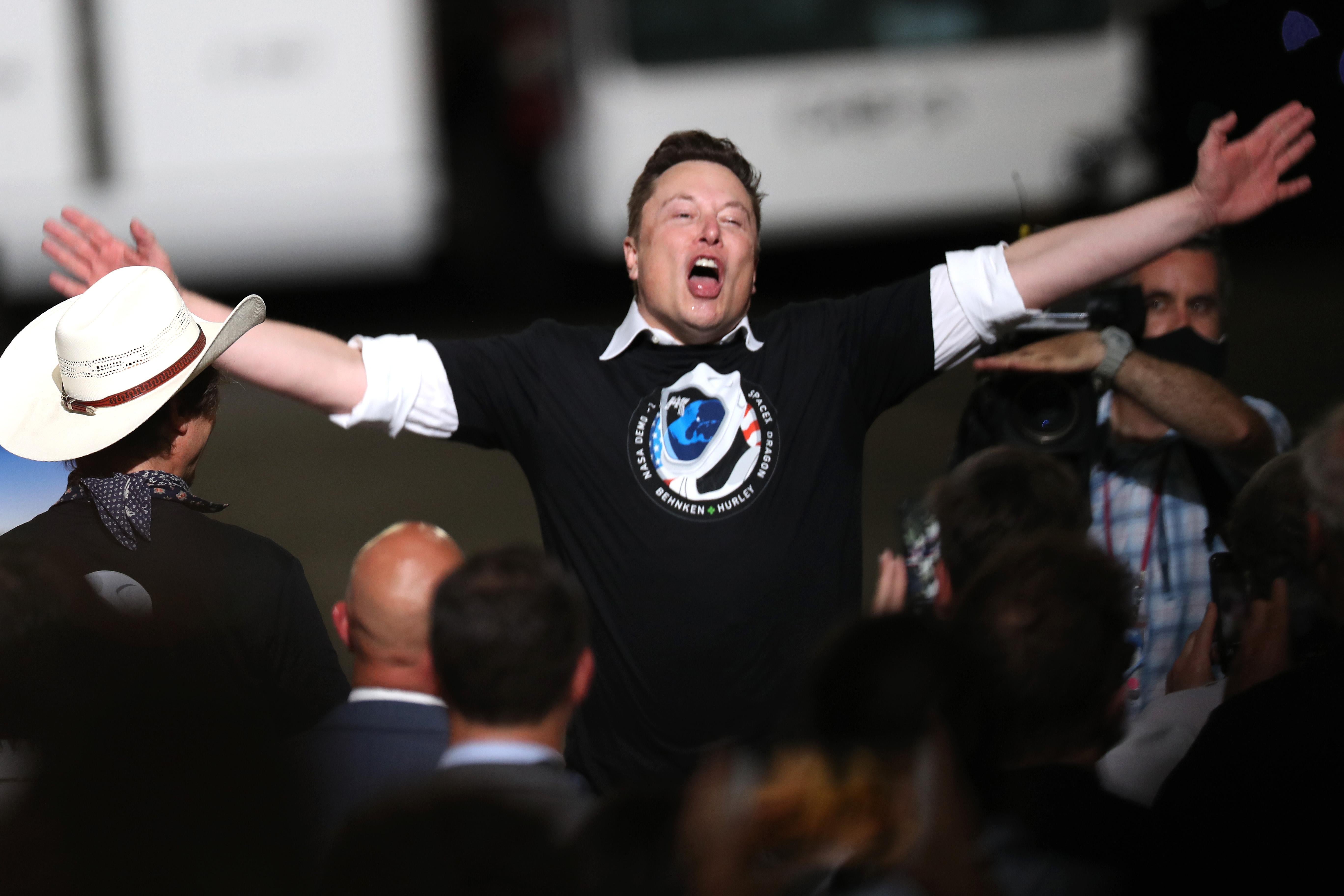 Spacex founder Elon Musk celebrates after the successful launch of the SpaceX Falcon 9 rocket with the manned Crew Dragon spacecraft at the Kennedy Space Center on May 30, 2020 in Cape Canaveral, Florida.