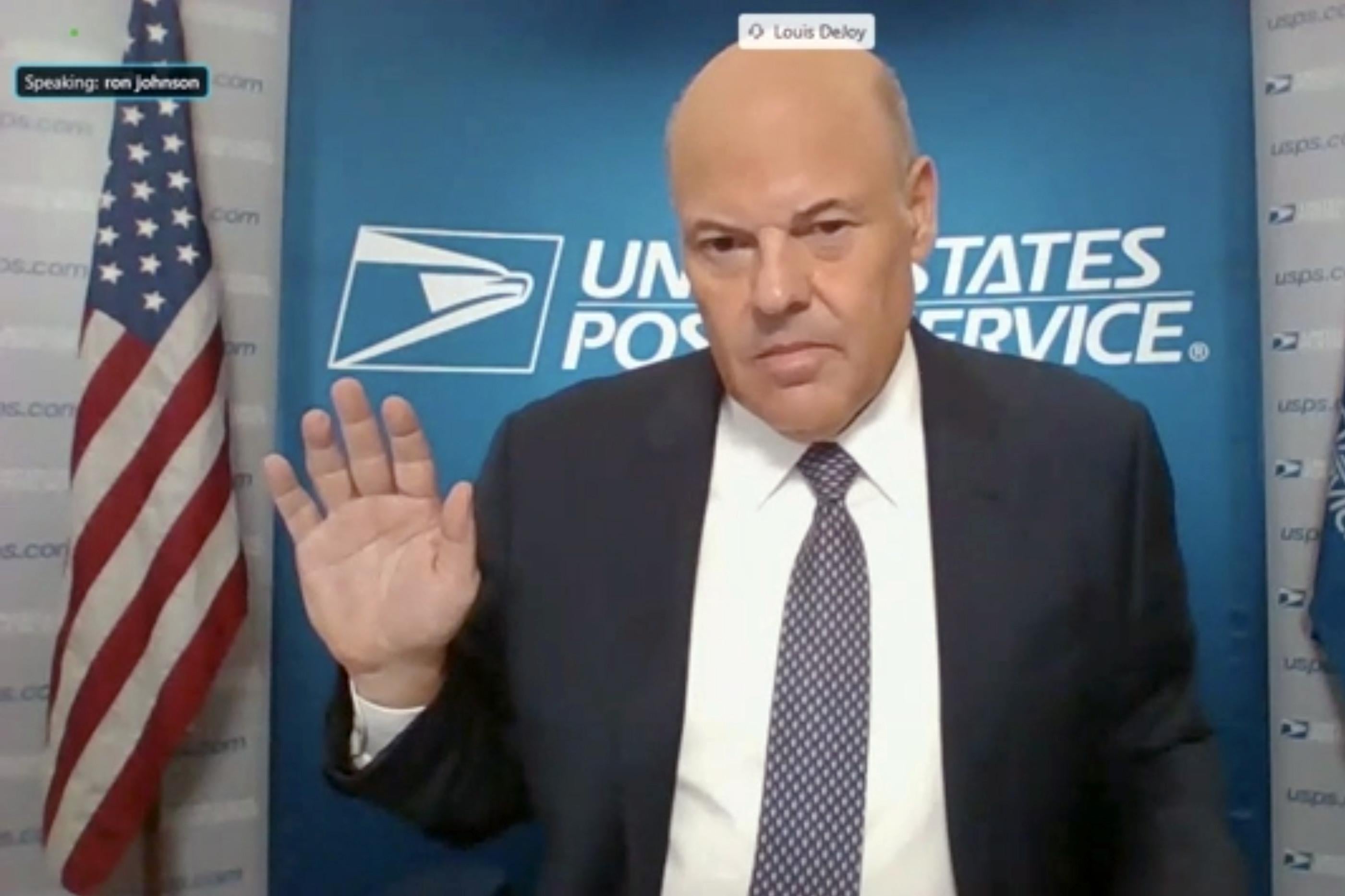 WASHINGTON, DC - AUGUST 21: In this screenshot from U.S. Senate's livestream, U.S. Postal Service Postmaster General Louis DeJoy is sworn in for a virtual Senate Homeland Security and Governmental Affairs Committee hearing on U.S. Postal Service operations during Covid-19 pandemic August 21, 2020 in Washington, DC. The USPS is under financial and operational scrutiny ahead of the upcoming November presidential elections, where mail-in voting is set to play a large role given the Covid-19 pandemic. (Photo by U.S. Senate Homeland Security and Governmental Affairs Committee via Getty Images)