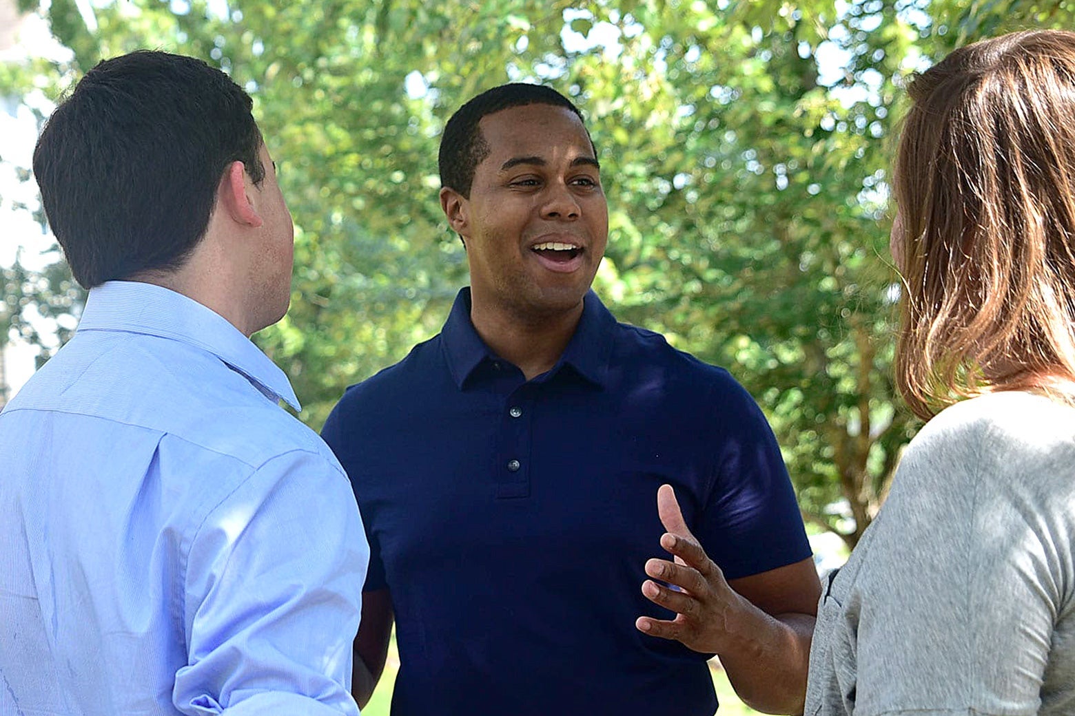 North Carolina state Rep. Chaz Beasley speaks to two people in this campaign photo.