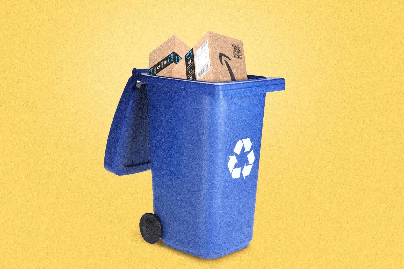 A blue recycling bin with Amazon boxes in it. 