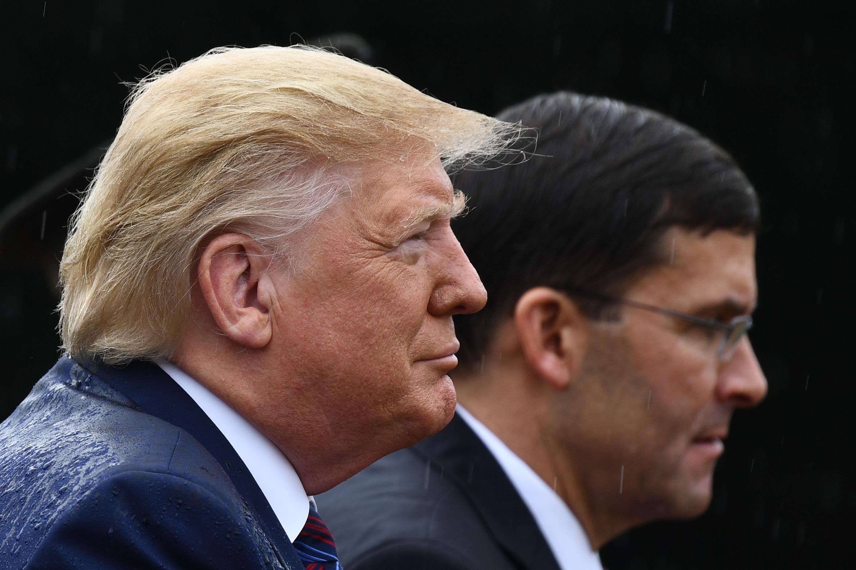 President Donald Trump and Secretary of Defense Mark Esper attend the Armed Forces Welcome Ceremony in honor of the Twentieth Chairman of the Joint Chiefs of Staff on September 30, 2019 at Summerall Field, Joint Base Myer-Henderson Hall, Virginia. 
