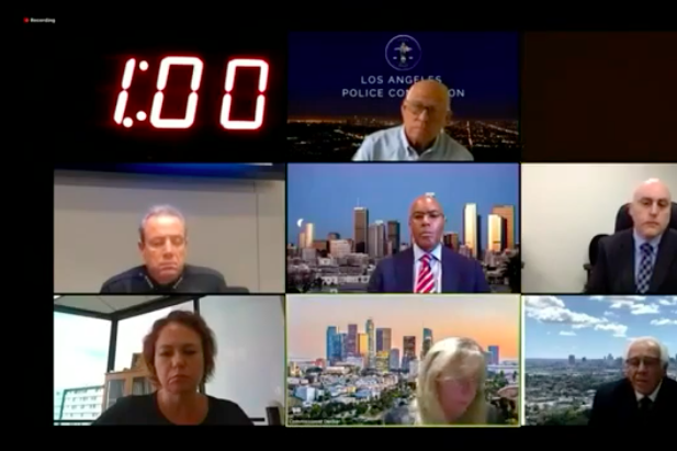 A Zoom box with seven squares of faces being berated and a one-minute timer.