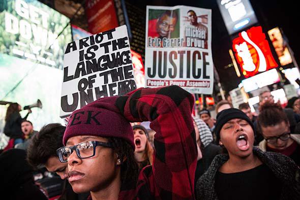 People protest in Times Square over the Ferguson grand jury decision to not indict officer Darren Wilson in the Michael Brown.