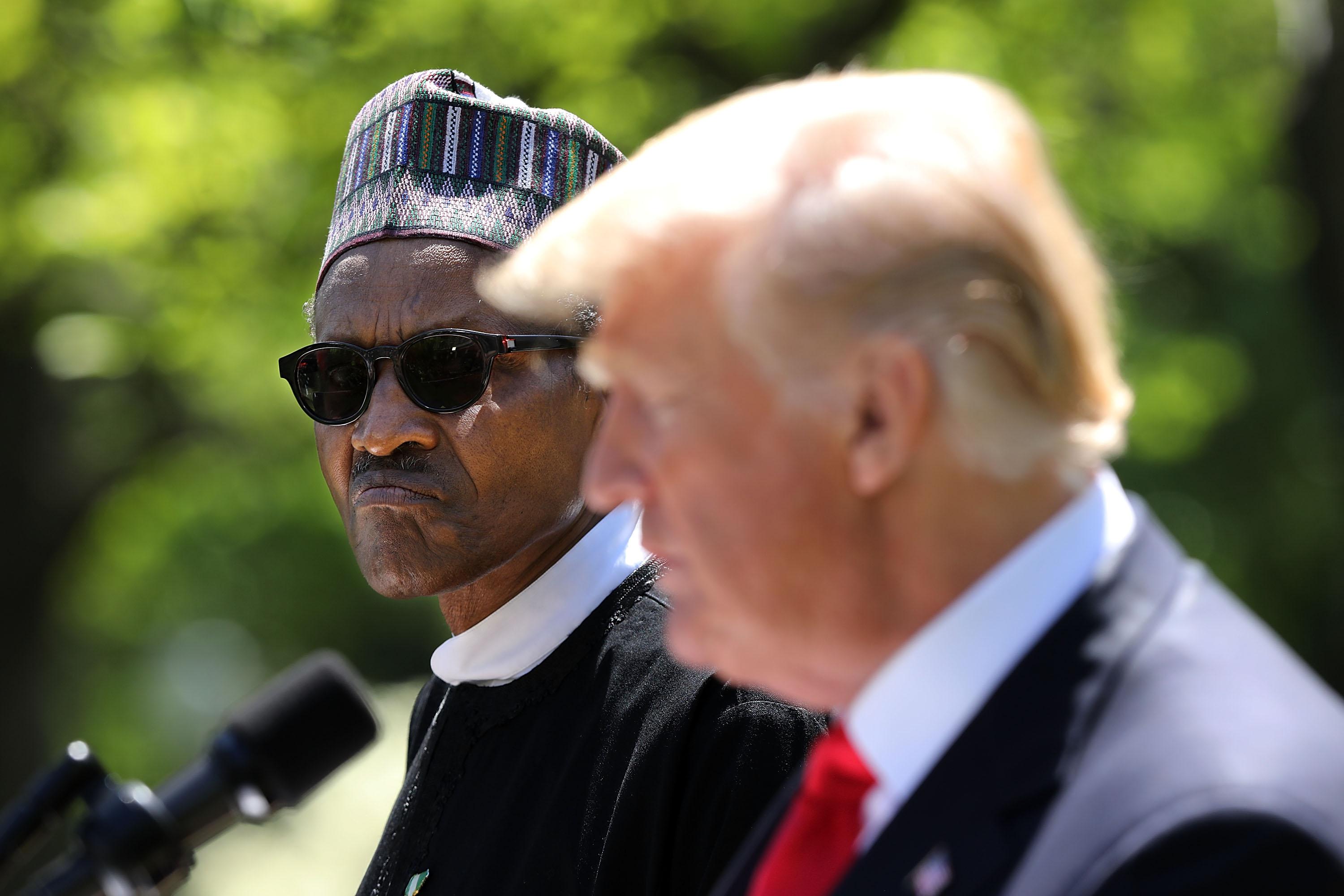 WASHINGTON, DC - APRIL 30:   Nigerian President Muhammadu Buhari (L) listens to U.S. President Donald Trump during their a joint press conference in the Rose Garden of the White House April 30, 2018 in Washington, DC. The two leaders also met in the Oval Office to discuss a range of bilateral issues earlier in the day.  (Photo by Chip Somodevilla/Getty Images)