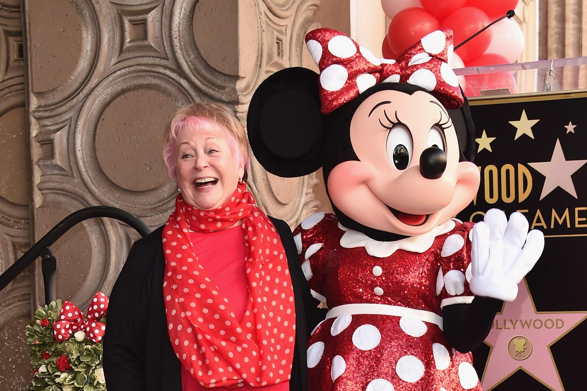 Russi Taylor, who has voiced Minnie Mouse since 1986, poses with Minnie Mouse at a Hollywood Boulevard star ceremony.