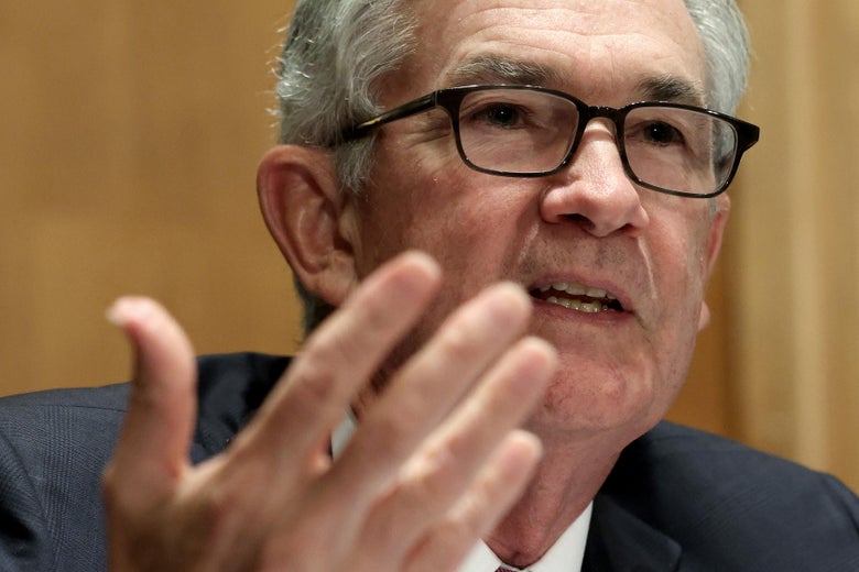 Jerome Powell gesturing with his right hand as he testifies before the Senate Banking, Housing, and Urban Affairs Committee