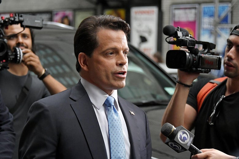 Anthony Scaramucci surrounded by cameras on a New York City street.