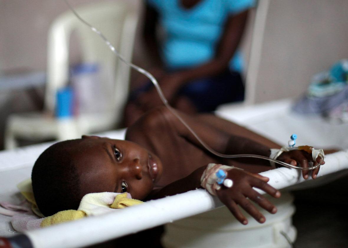 Evenel Dorvilier rests on a stretcher in the Cholera Treatment Center.