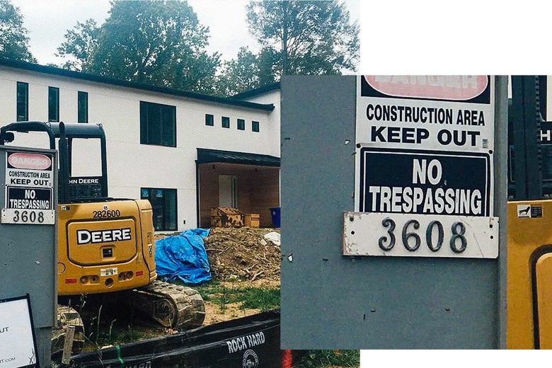 A house under construction with a warning posted.