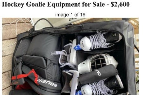 A bag of skates and other equipment for sale.