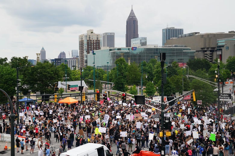 People gather during a protest against police brutality on June 6, 2020 in Atlanta.