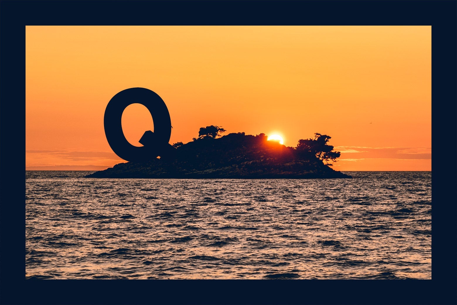 A deserted island at sunset with a large letter "Q" on it.