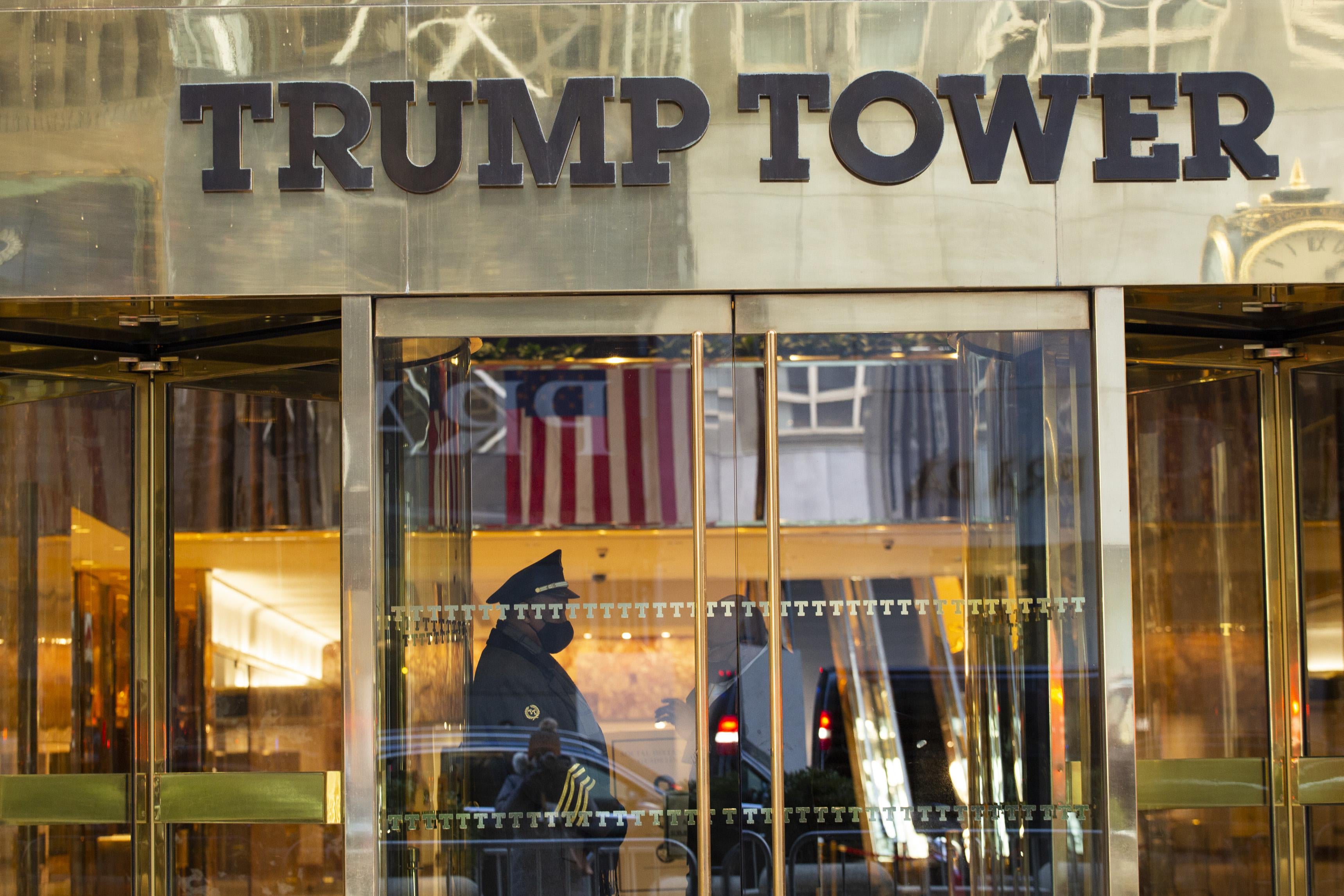 A security guard stands at the door of Trump Tower in New York.