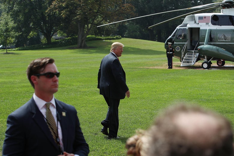 Donald Trump walks to Marine One.
