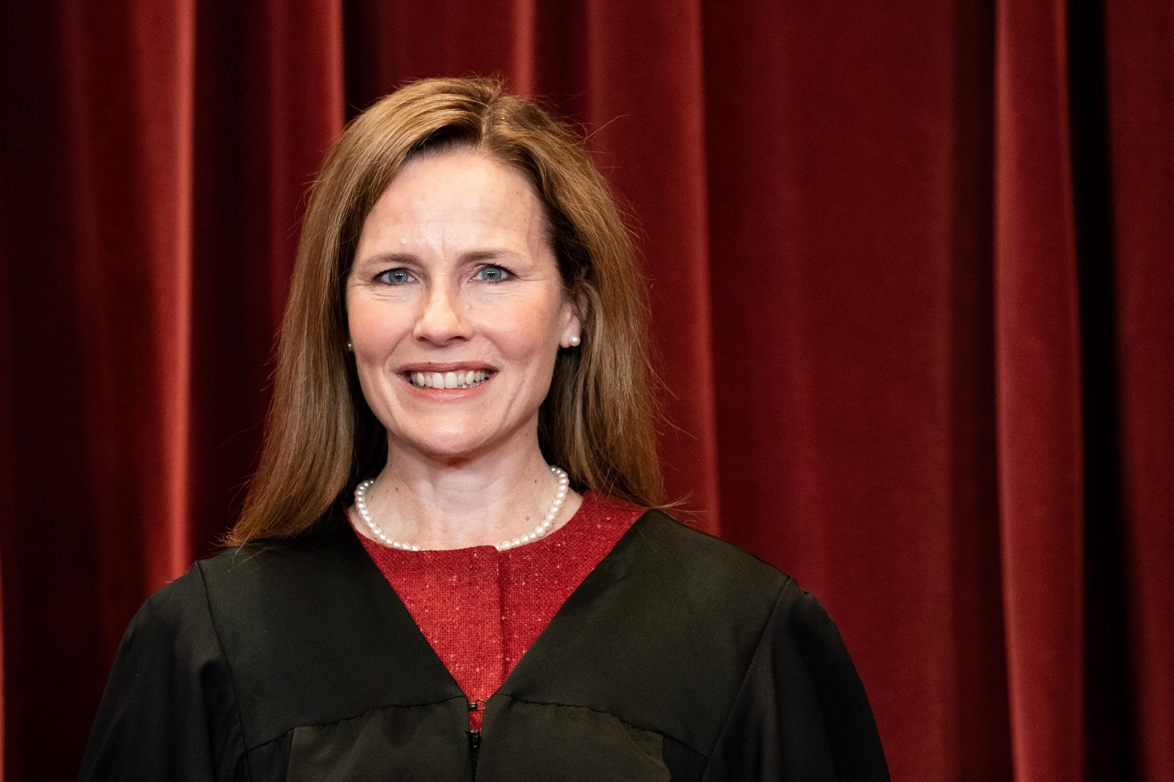 Associate Justice Amy Coney Barrett stands during a group photo of the Justices at the Supreme Court in Washington, DC on April 23, 2021.